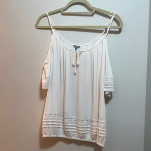 Cream color exposed shoulder shirt